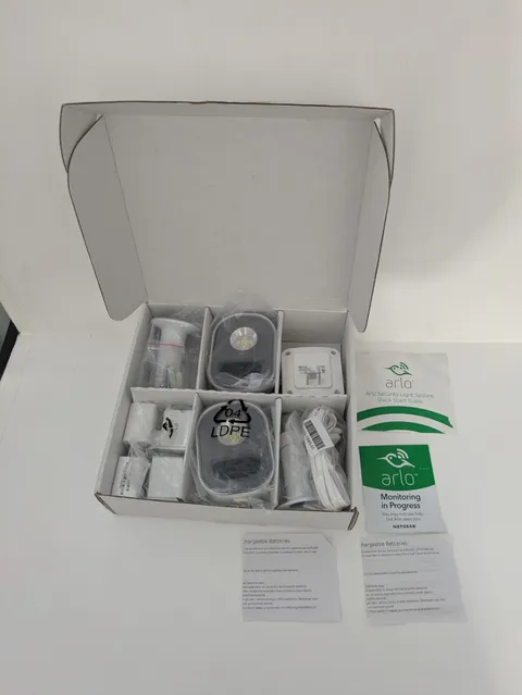 2 Arlo Home Security Light Sensor AL1101. 2 Batteries. 2 Mounts.1 Bridge ABB1000