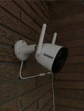 Defender Powered 4K Guard Pro Wi-Fi 6-Plug-in Security Camera In Hand Now