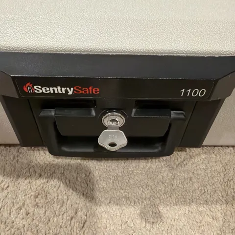 Sentry Safe 1100 Fire Proof Safe with Keys Valuables Portable Lock Box 1 key