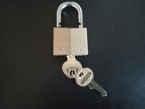 BRASS MASTER LOCK -  MEASURES  1 1/2 X 1 1/4 INCHES - WITH 2 KEYS  NO 140