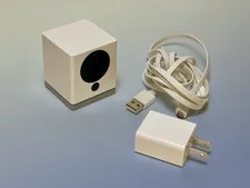 WyzeCam V2 with USB power cord and wall outlet