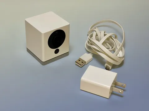 WyzeCam V2 with USB power cord and wall outlet