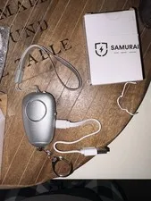 New Samurai Personal Alarm Keychain with LED Lights, charging cord -  Silver