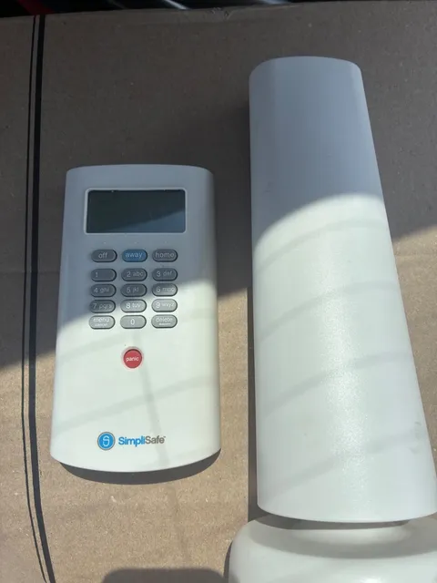 SimpliSafe Security System Kit - See Details. Console and Remote.