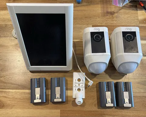 2 Ring Spotlight Cams White Outdoor with 4 Batteries 1 Solar Panel No Brackets.