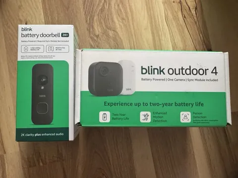Blink Outdoor 4 Battery Powered Camera with Sync Module + Battery Doorbell 2K