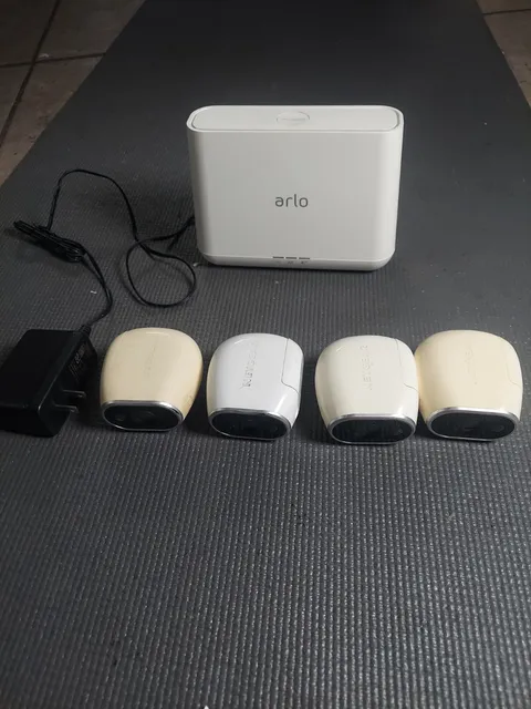 4 Arlo VMC3030 cameras with VM4000 base station (batteries not included)