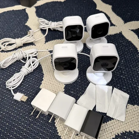 Quantity 4 Blink Mini Indoor Plug-In HD Smart Security Camera + Mounts Chargers
