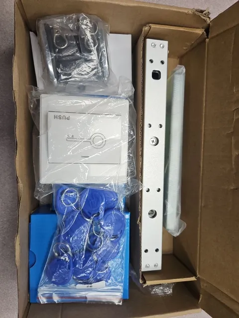 Door Access Control System kit containing a magnetic lock, exit button, and RFID