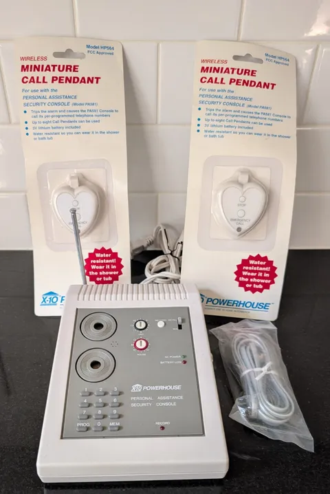 X-10 Powerhouse Personal Assistance Security System PA581 with 2 call pendants