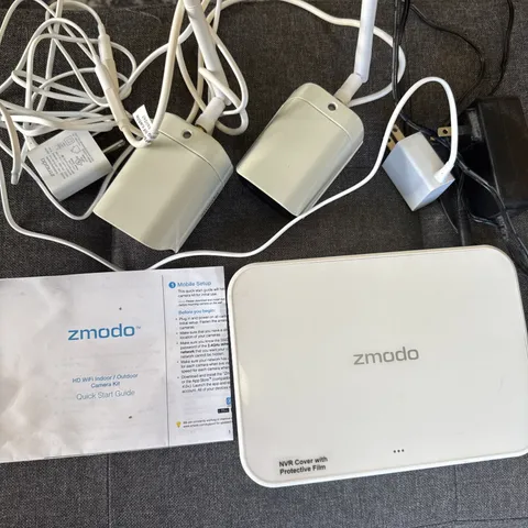 5 Zmodo Wireless Security Recording cameras. With one TB modem.  