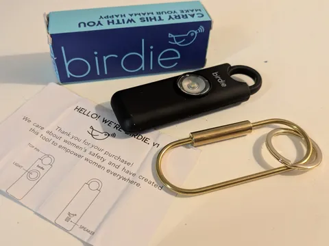 Birdie Personal Safety Alarm For Women Loud Siren, Strobe Light, Black Gold Ring