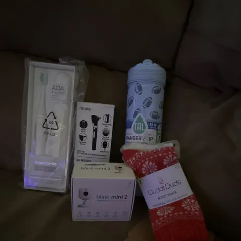 Lot of multiple items.  Camera toothbrush socks. Water bottle otoscope