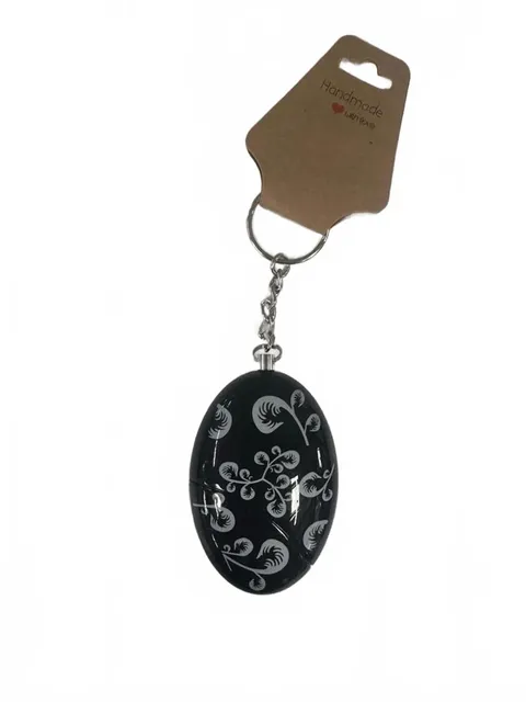 Chic Black Oval Keychain with Elegant White Floral Swirls – Carry Style Wherever